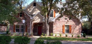 Brick-front suburban home in Far North Dallas, TX