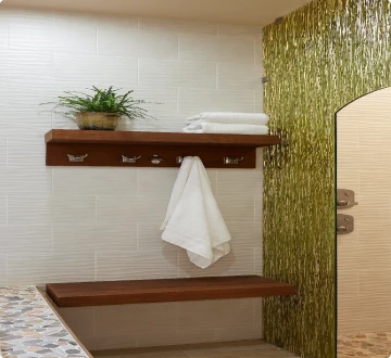 Bathroom shelf with towel and plant