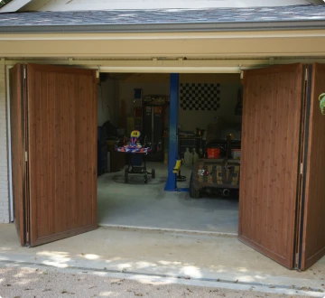 Open garage with tools and go-kart inside.
