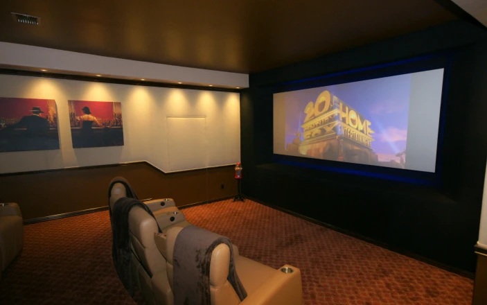 Luxury home theater with large screen and seating