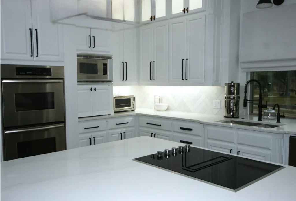 Modern kitchen with white cabinets and appliances