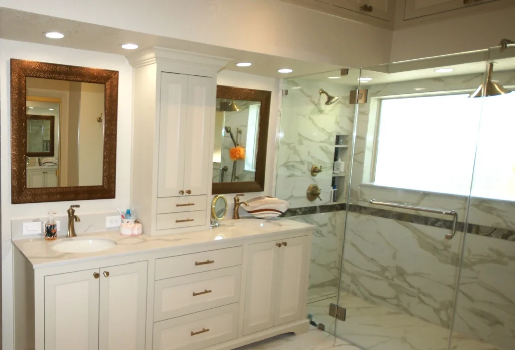 Modern bathroom with marble shower and double vanity.
