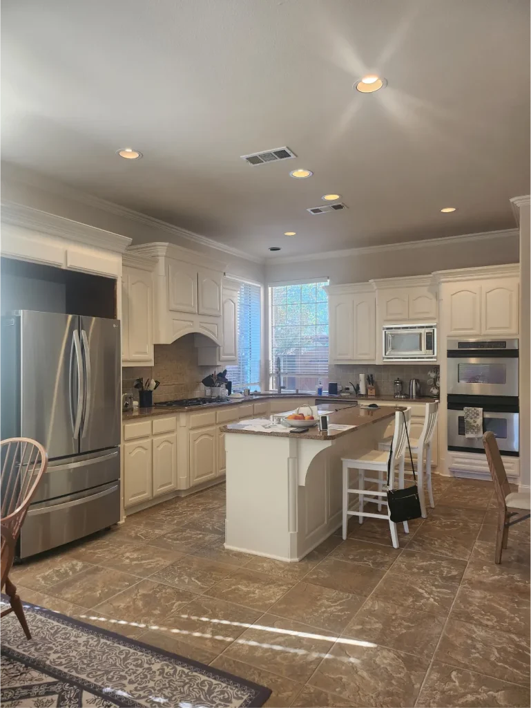 Illuminated kitchen area with kitchen island