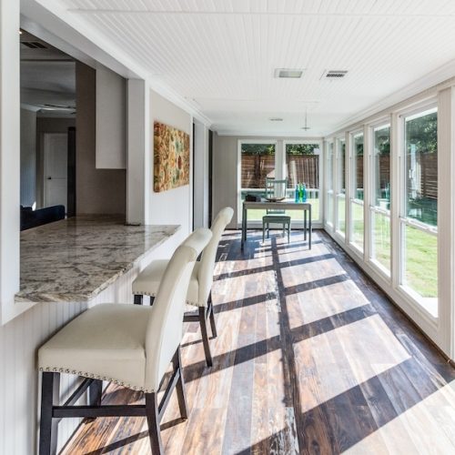 Workspace in Sunroom with Natural Light and Modern Remodel