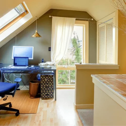 Office space in a home with blue chair and blue decorations with white walls